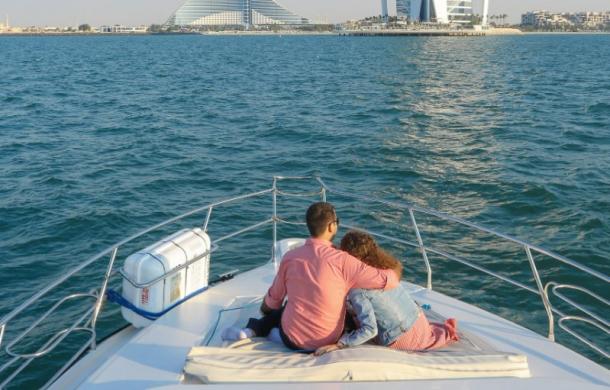 Romantic couple on a yacht deck near Burj al Arab